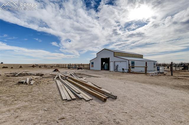 39301 Jacobson Road Rush, CO 80833 - Photo 34 of 40 Looking towards the Over Sized 3 car Garage/Shop/Barn with 13ft sidewalls