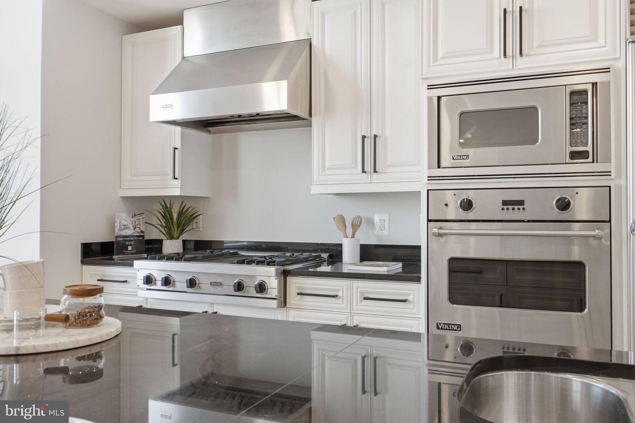 11990 Market Street, Unit 2103 Reston, VA 20190 - Photo 15 of 78 Sleek modern kitchen with stainless steel.