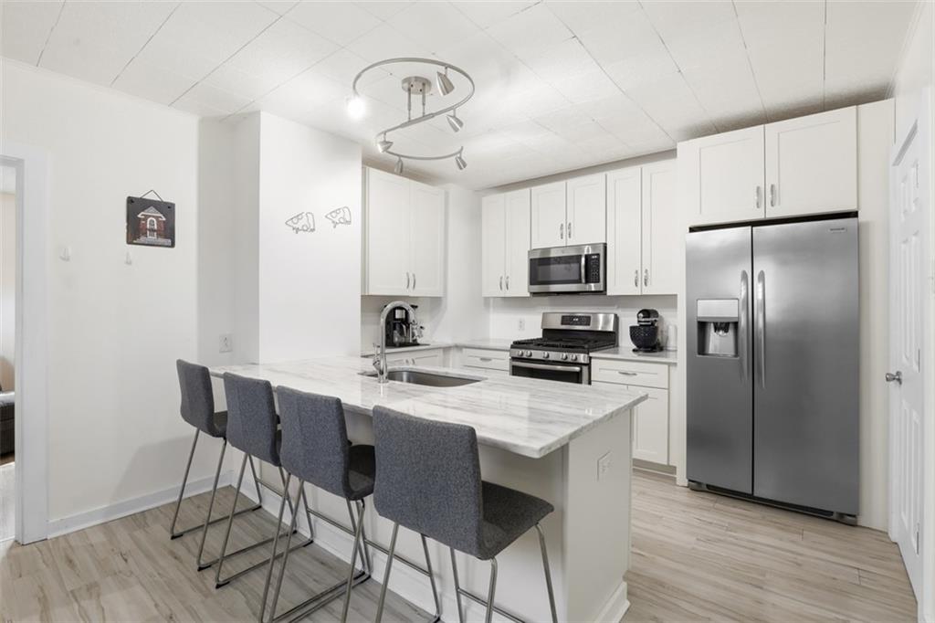447 Edith Street Pittsburgh, PA 15211 - Photo 9 of 37 Tons of cabinetry and stainless-steel appliances