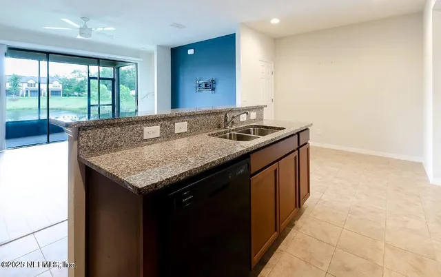 a kitchen with a sink stove and refrigerator