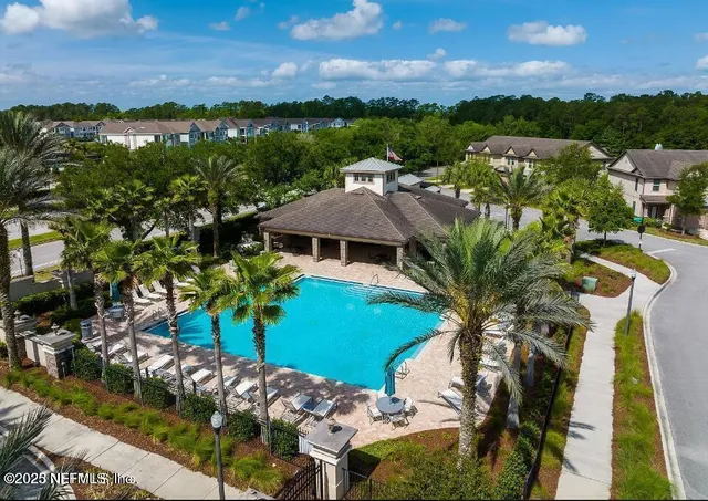 a view of a room with gym equipment and a large window