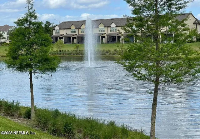 a view of a swimming pool with chairs