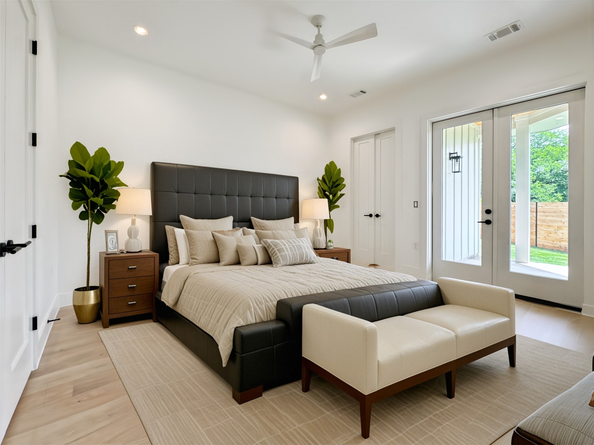 a spacious bedroom with a bed and a couch