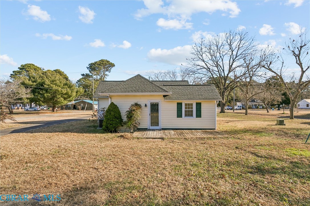 2290 Hayes Road Hayes, VA 23072 - Photo 29 of 32 View of front of house with a front yard and a shingled roof