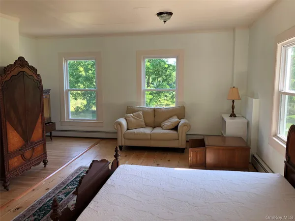 a living room with furniture and a rug
