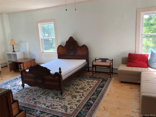 a living room with furniture and a rug