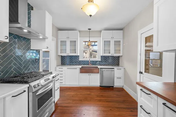 a kitchen with a stove and a sink
