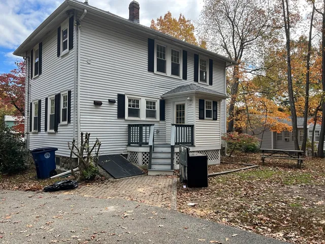 a front view of a house with parking space