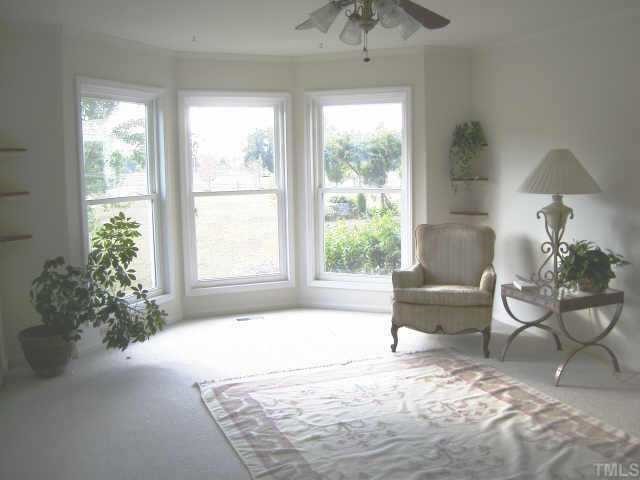8811 Art Road Cedar Grove, NC 27231 - Photo 5 of 11 Sunny living room with bay window and view of front yard & fruit trees.
