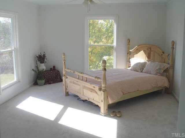 8811 Art Road Cedar Grove, NC 27231 - Photo 8 of 11 Large master bedroom (17x13) with large CEDAR walk-in-closet and bathroom with dual vanities, garden tub, separate shower.