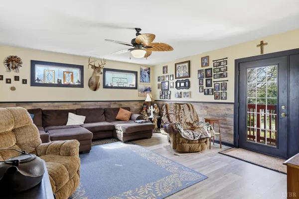 a living room with furniture and wooden floor