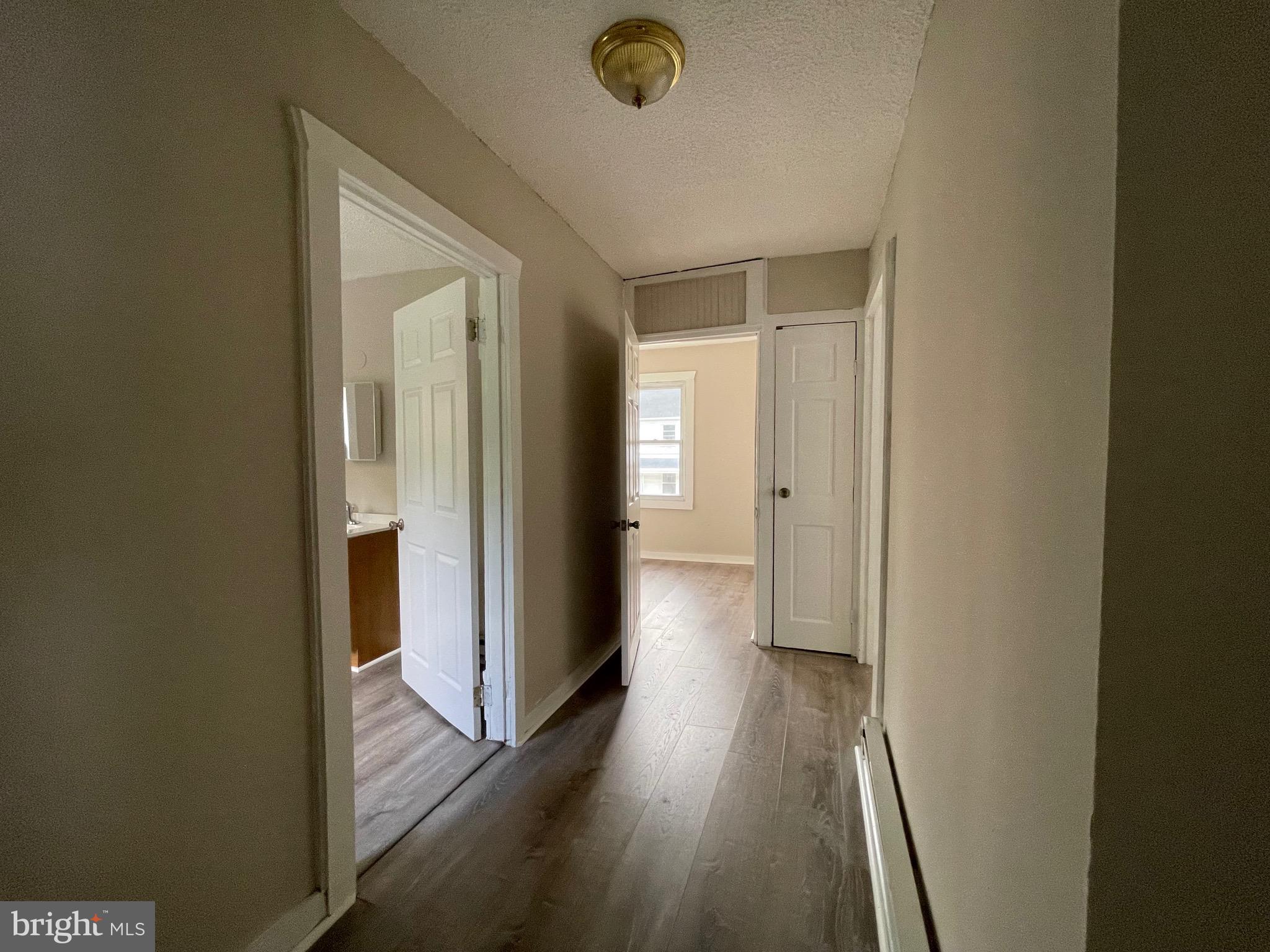 382 East Broadway, Unit 2 Salem, NJ 08079 - Photo 6 of 6 a view of a hallway with wooden floor
