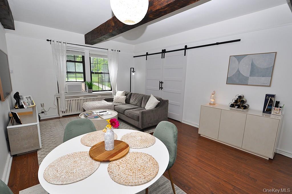 192 Garth Road, Unit TP Scarsdale, NY 10583 - Photo 9 of 43 Designed for both everyday living and effortless entertaining, the spacious living room flows seamlessly into a formal dining room that offers remarkable flexibility as a home office, den, or potential third bedroom.