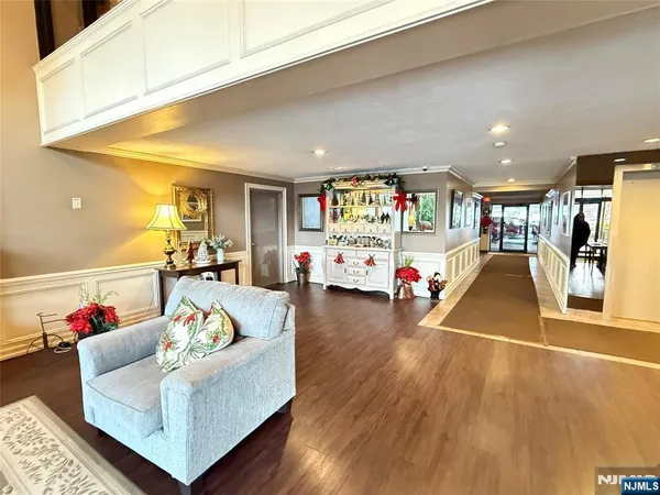 a living room with furniture and floor to ceiling window