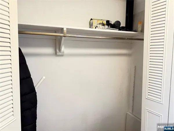 a kitchen with granite countertop a sink stove and refrigerator