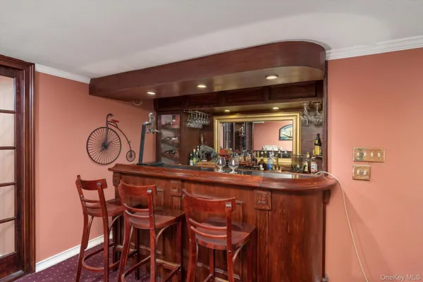 a room with a table chairs and entryway