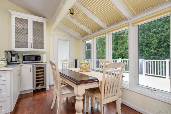 a view of a dining room with furniture window and outside view