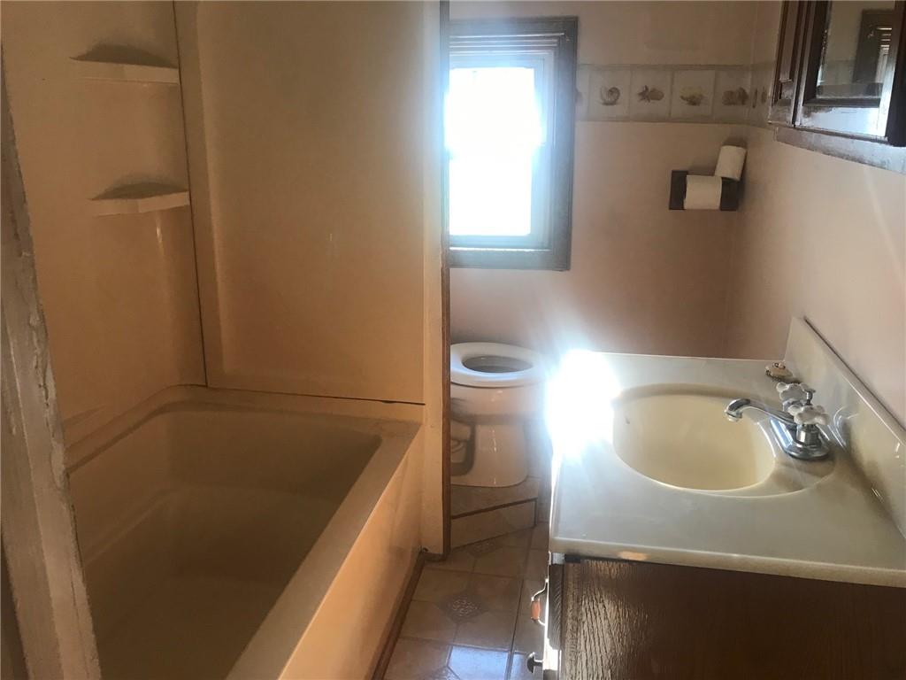 118 Vance Road New Castle, PA 16102 - Photo 14 of 18 a bathroom with a sink and a toilet