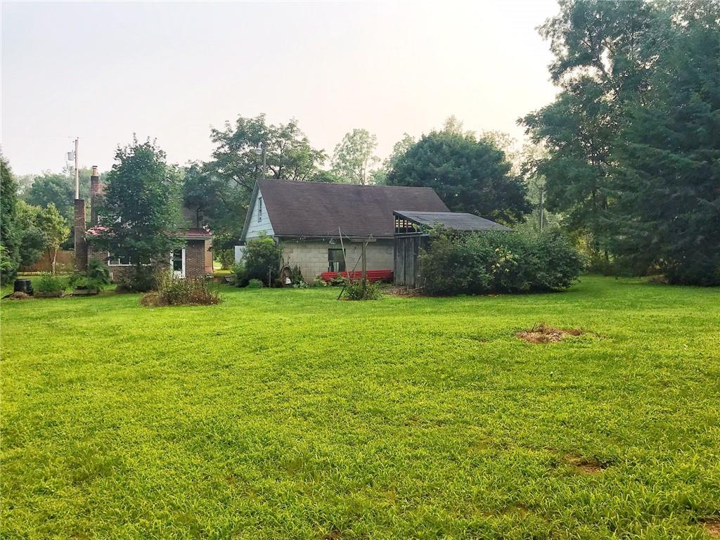 118 Vance Road New Castle, PA 16102 - Photo 17 of 18 a view of house with garden space and trees