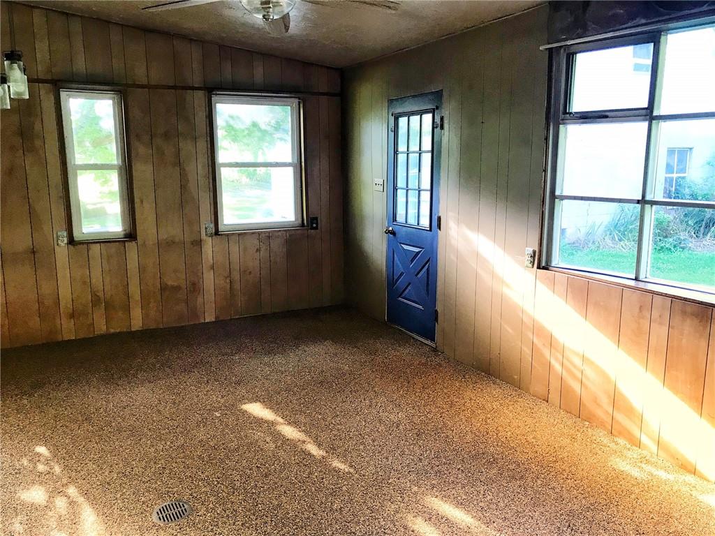 118 Vance Road New Castle, PA 16102 - Photo 5 of 18 a view of an empty room with a window