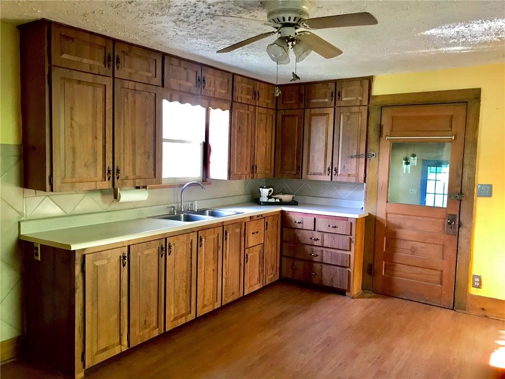 118 Vance Road New Castle, PA 16102 - Photo 6 of 18 a kitchen with stainless steel appliances granite countertop a sink and a stove