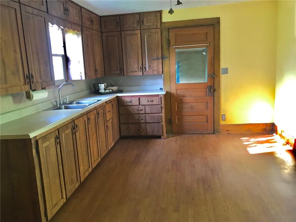 118 Vance Road New Castle, PA 16102 - Photo 7 of 18 a view of a kitchen with a sink cabinets and a window