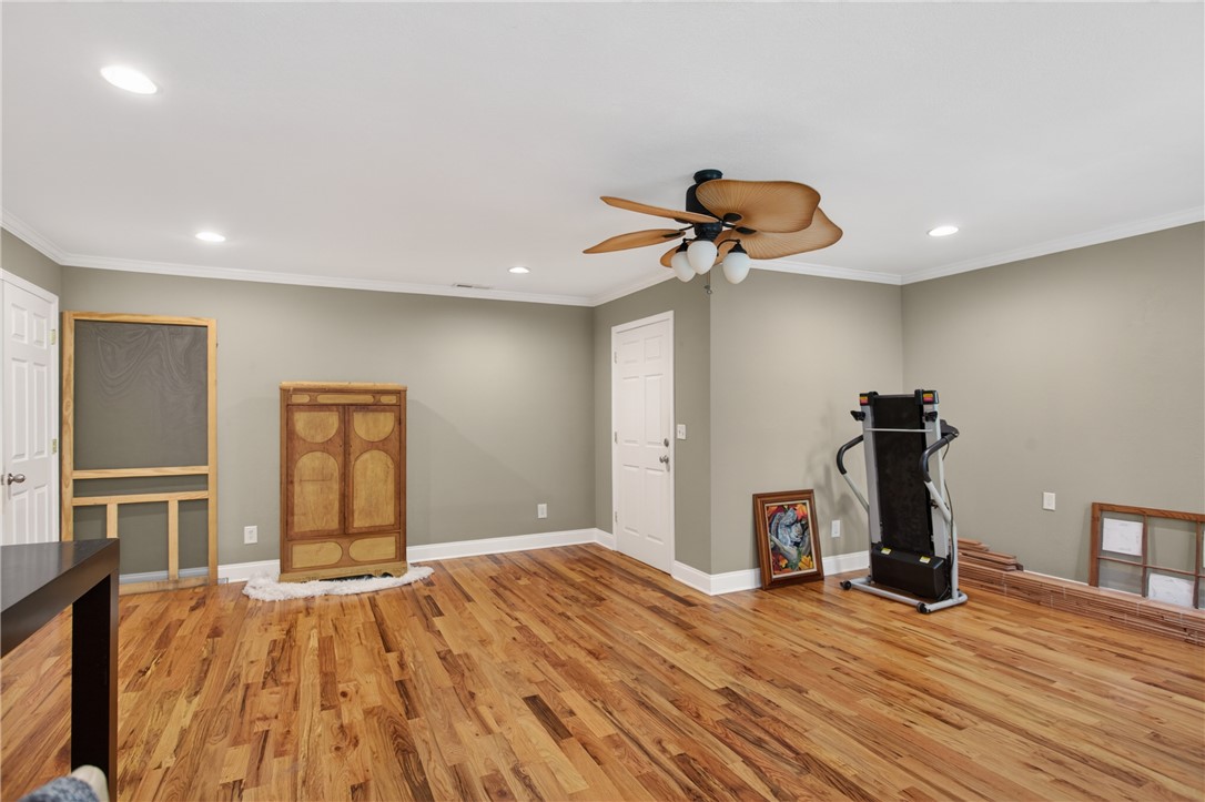 151 Towne Creek Trail Anderson, SC 29621 - Photo 30 of 49 Rich hardwood flooring stretches across this adaptable room, perfect for various household needs.