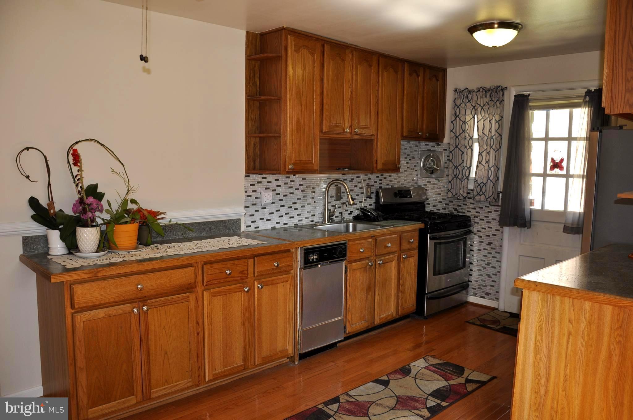 11405 Veirs Mill Road Wheaton, MD 20902 - Photo 3 of 24 Updated kitchen-Gas stove,SS FrenchDr Fridge, Hdwd