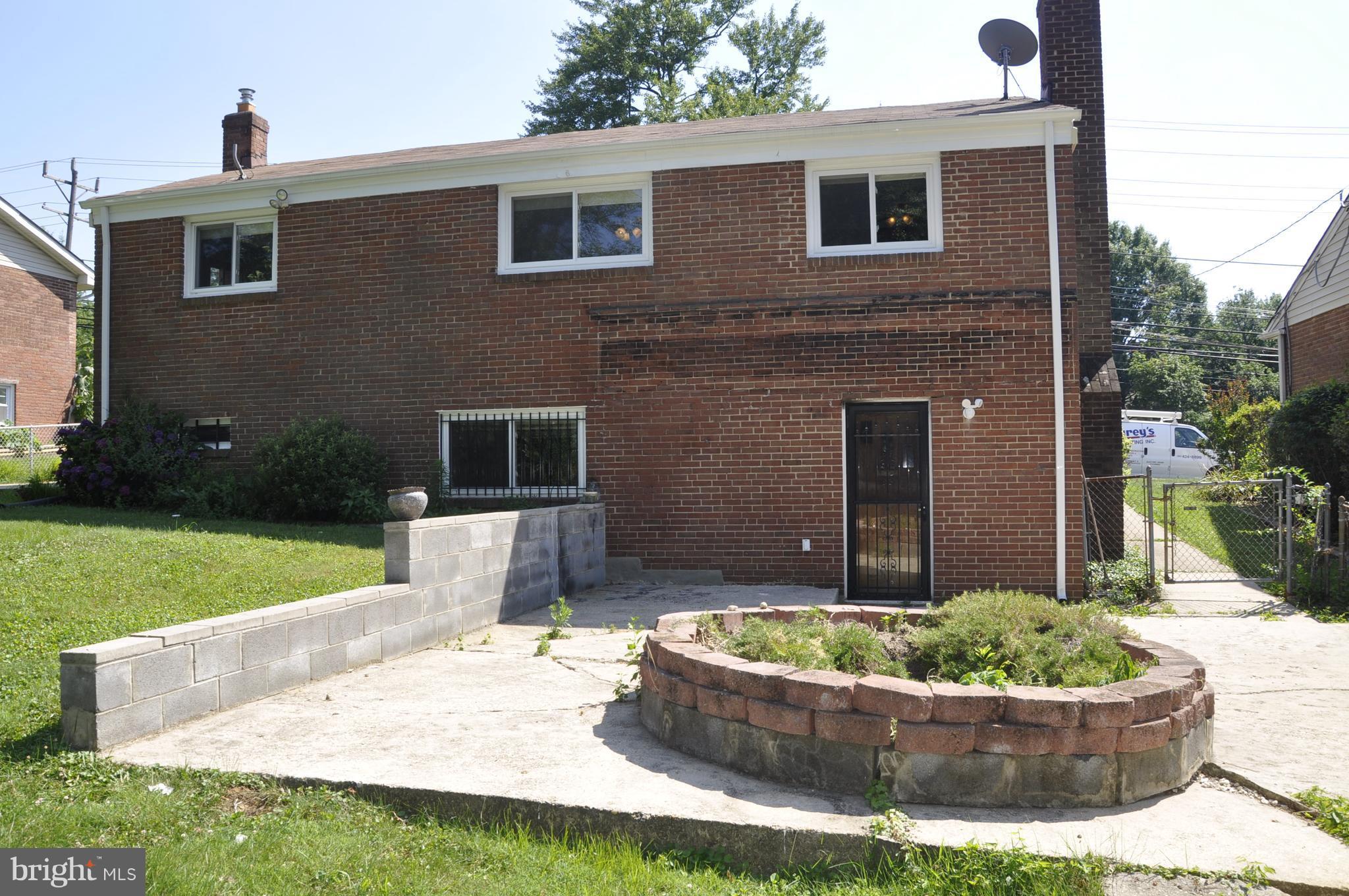 11405 Veirs Mill Road Wheaton, MD 20902 - Photo 24 of 24 Back yard patio w/LL Family Rm entry