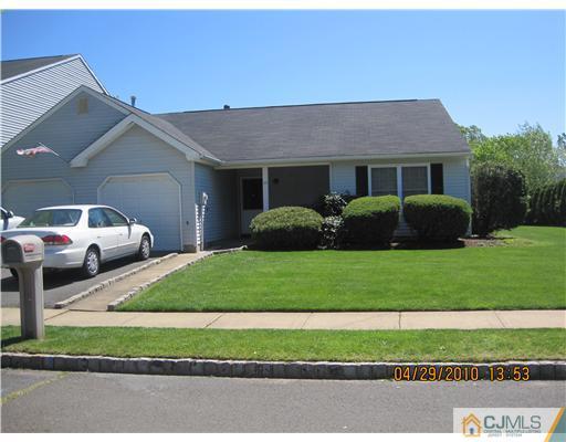 25 Woodbury Road Edison, NJ 08820 - Photo 1 of 8 a house view with a garden space