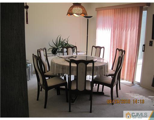 25 Woodbury Road Edison, NJ 08820 - Photo 3 of 8 a view of a dining room with furniture and window