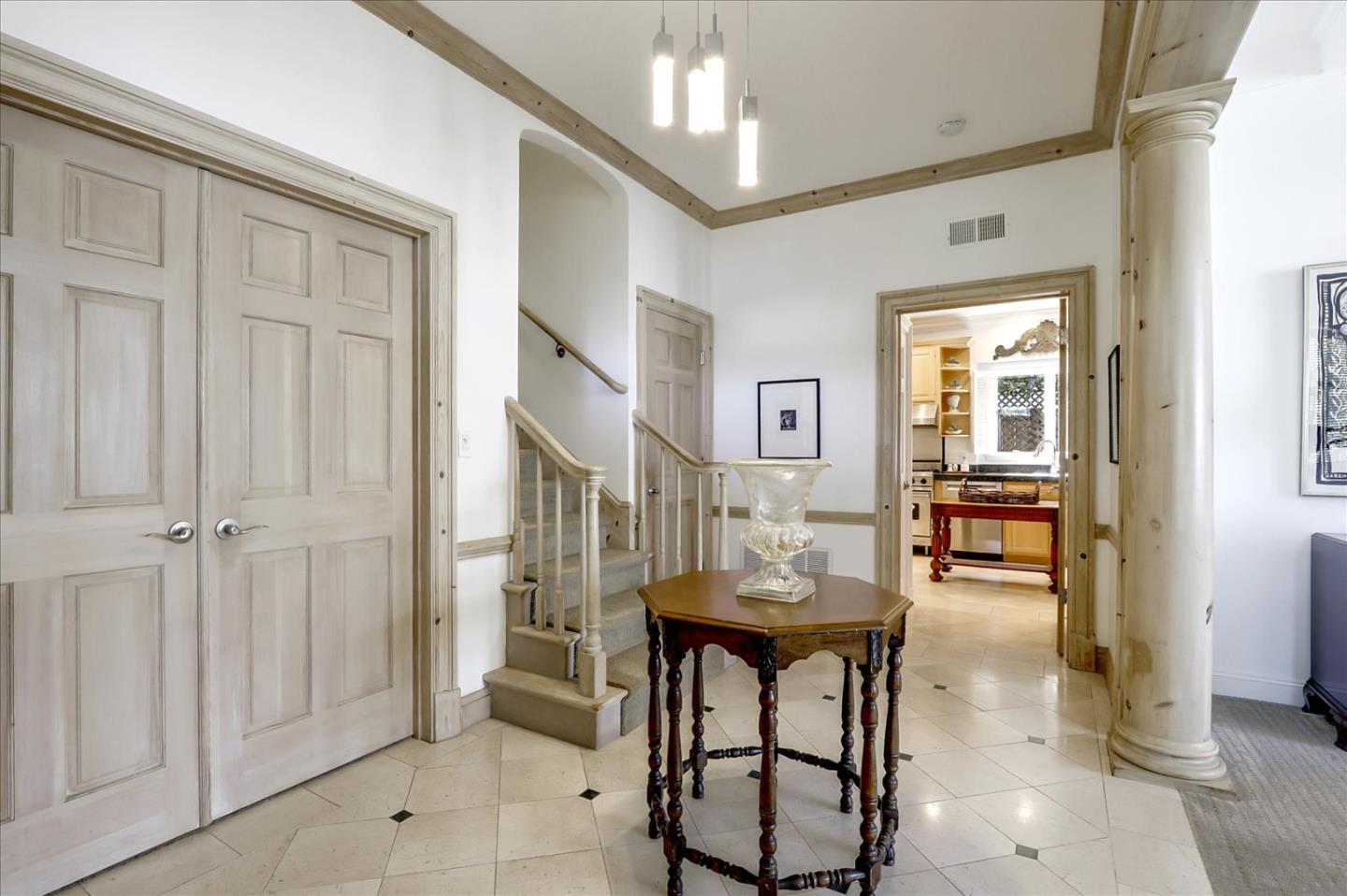 85 Clarendon Road Pacifica, CA 94044 - Photo 11 of 74 a dining room with furniture and a chandelier