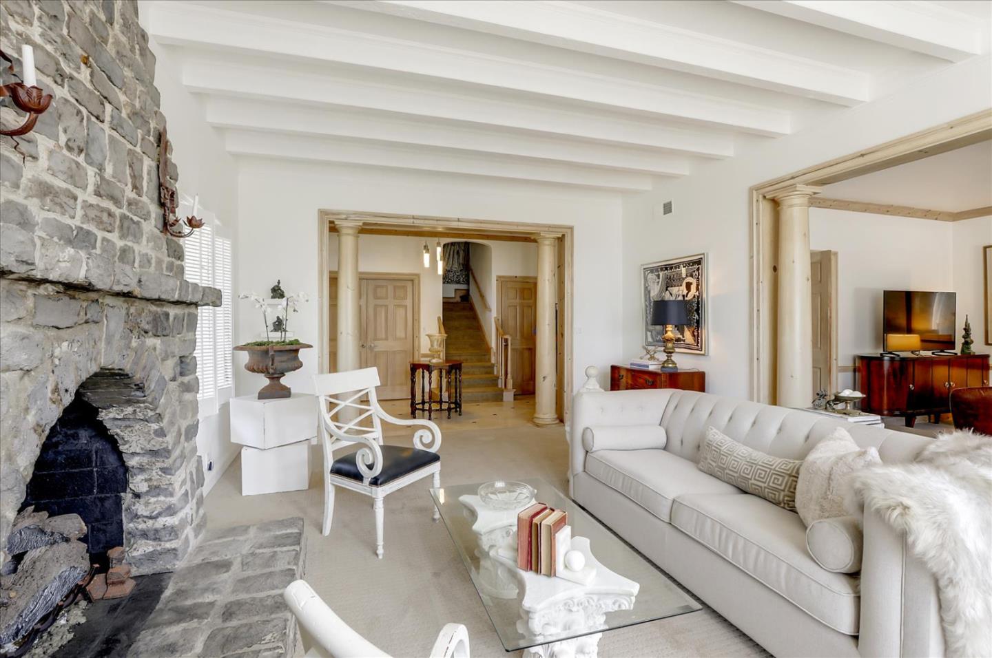 85 Clarendon Road Pacifica, CA 94044 - Photo 15 of 74 a living room with furniture and a fireplace