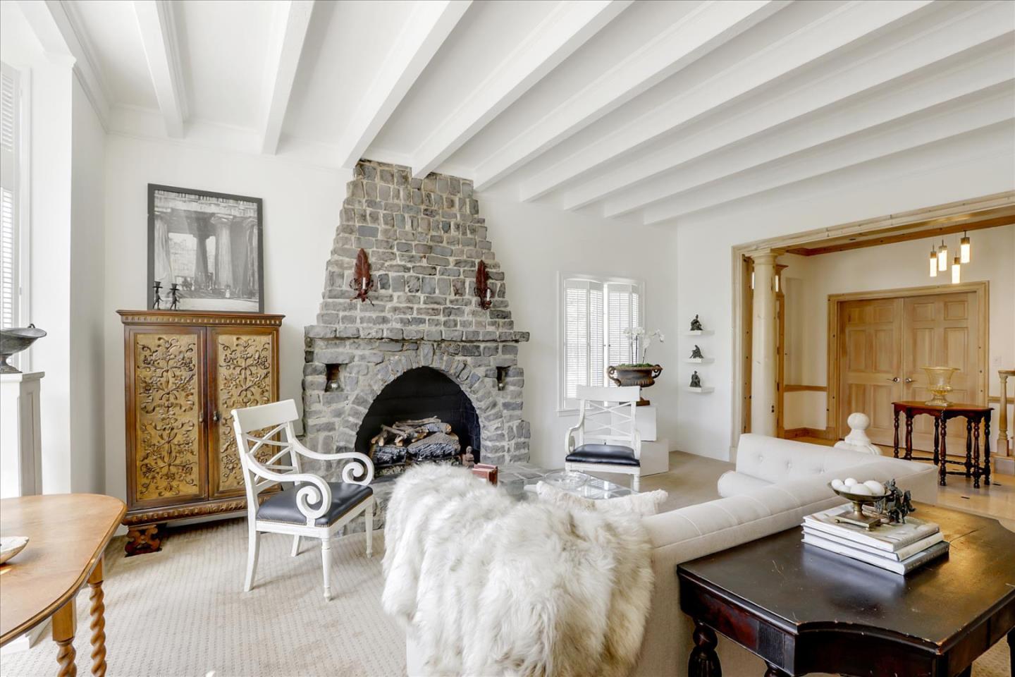 85 Clarendon Road Pacifica, CA 94044 - Photo 16 of 74 a living room with furniture and a fireplace
