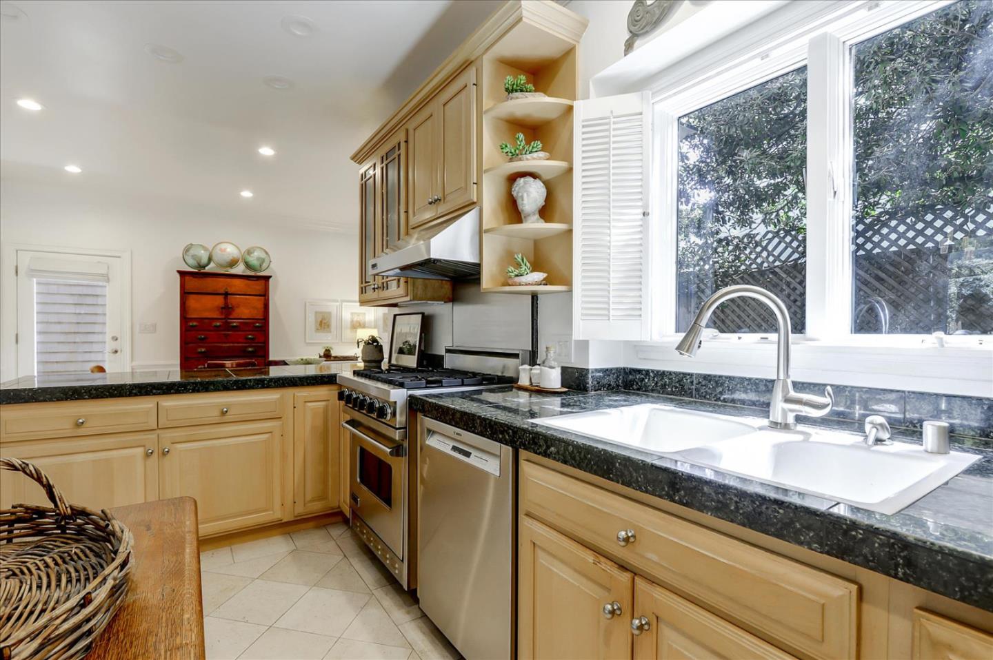 85 Clarendon Road Pacifica, CA 94044 - Photo 26 of 74 a kitchen with granite countertop a sink and a stove top oven