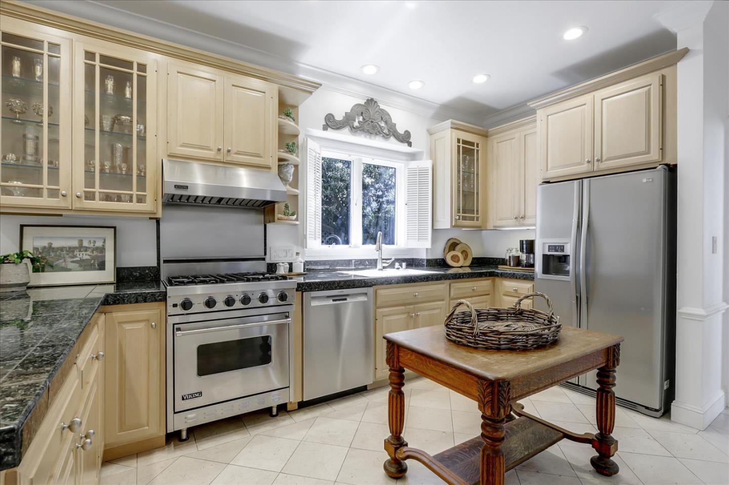 85 Clarendon Road Pacifica, CA 94044 - Photo 28 of 74 a kitchen with a stove a refrigerator and furniture
