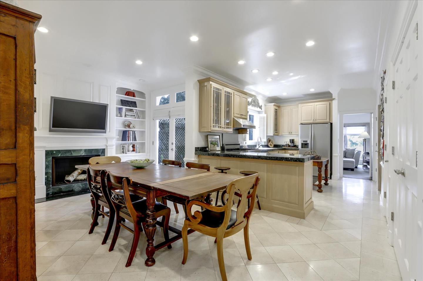 85 Clarendon Road Pacifica, CA 94044 - Photo 33 of 74 a dining room with stainless steel appliances granite countertop a table chairs and a refrigerator