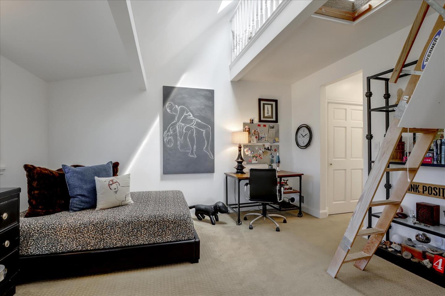 85 Clarendon Road Pacifica, CA 94044 - Photo 44 of 74 a living room with furniture and a book shelf