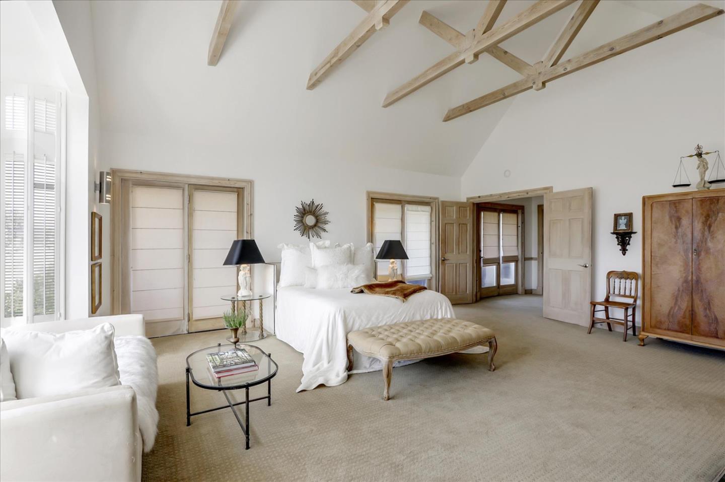 85 Clarendon Road Pacifica, CA 94044 - Photo 48 of 74 a spacious bedroom with a bed and a couch