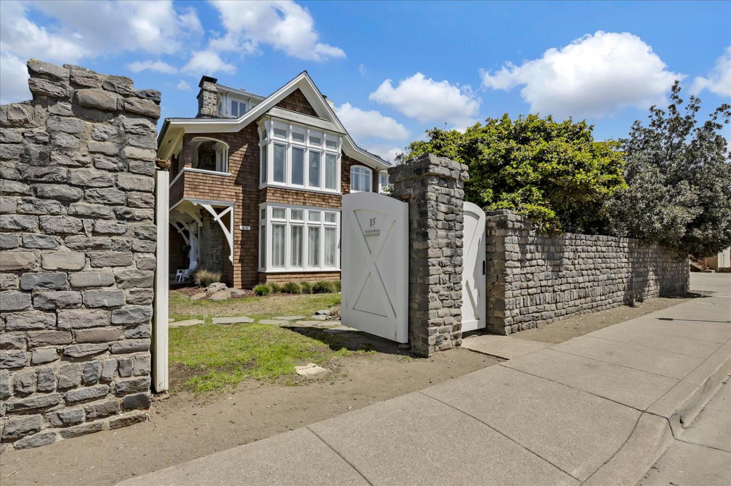 85 Clarendon Road Pacifica, CA 94044 - Photo 6 of 74 a front view of a house with a yard