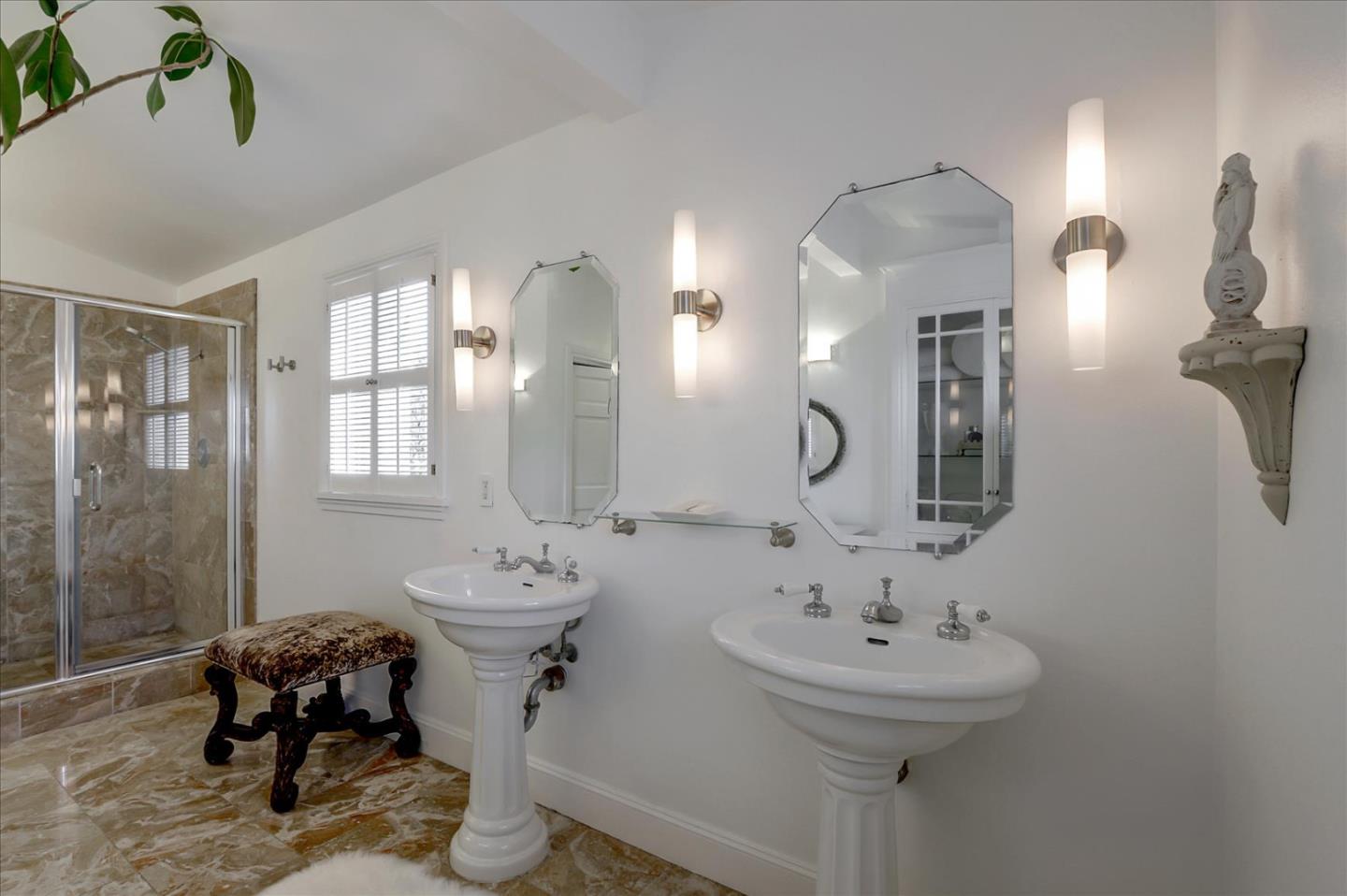 85 Clarendon Road Pacifica, CA 94044 - Photo 62 of 74 a bathroom with a sink two mirror and a toilet