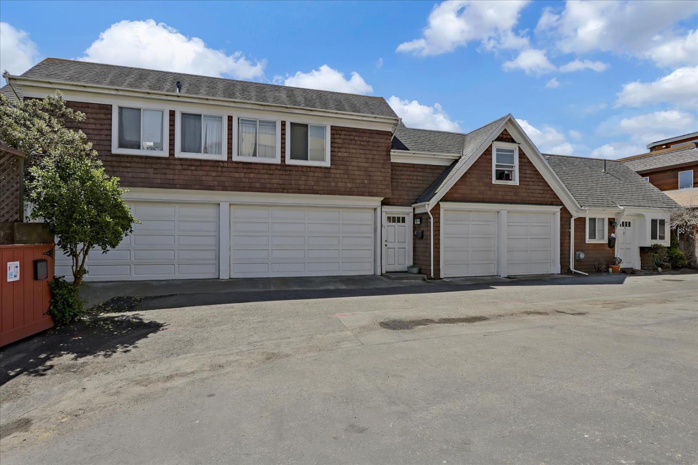 85 Clarendon Road Pacifica, CA 94044 - Photo 73 of 74 a front view of a house with a yard and garage