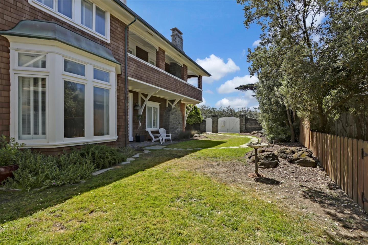 85 Clarendon Road Pacifica, CA 94044 - Photo 9 of 74 a view of a patio with chair and tables back yard of the house