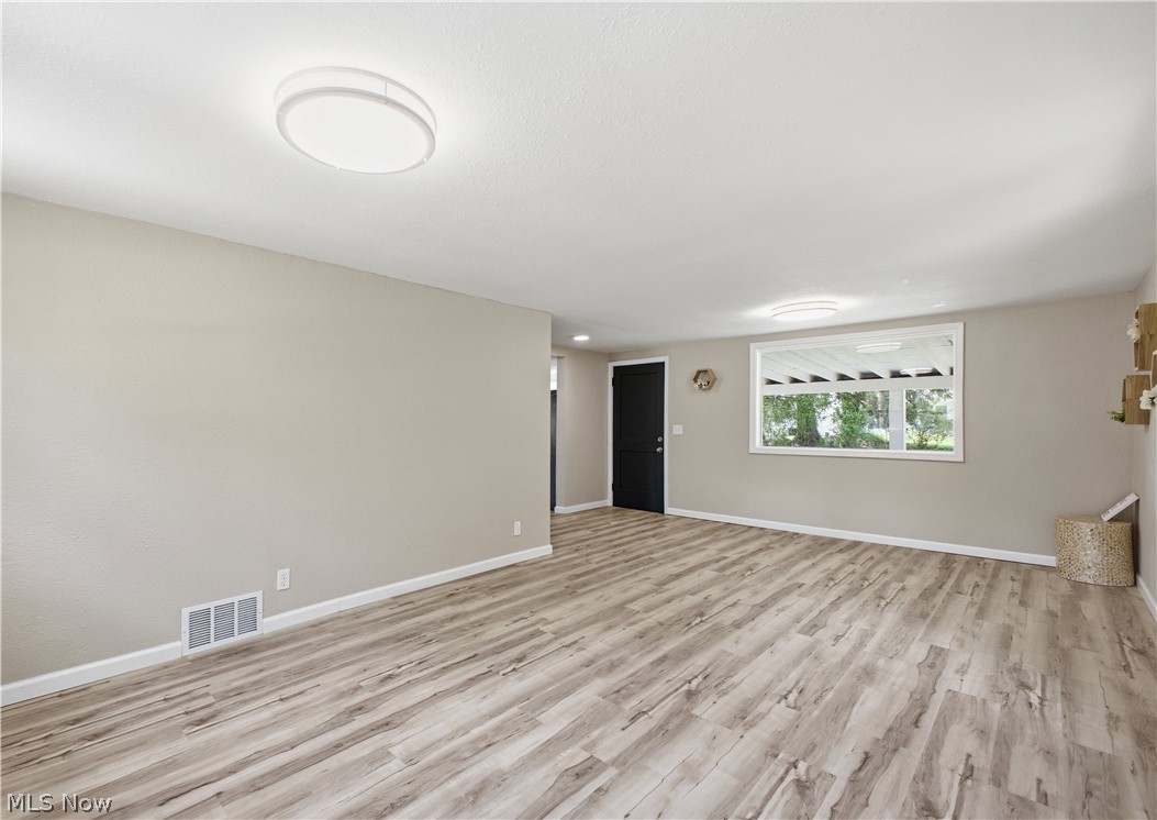 3232 Bears Den Road Youngstown, OH 44511 - Photo 13 of 38 Spacious interior with wood-finish flooring, neutral-toned walls, and recessed lighting