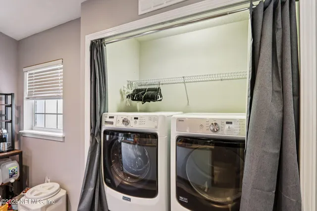 a utility room with dryer and washer