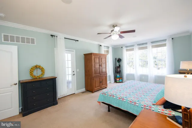 a bedroom with a bed and a lamp with window