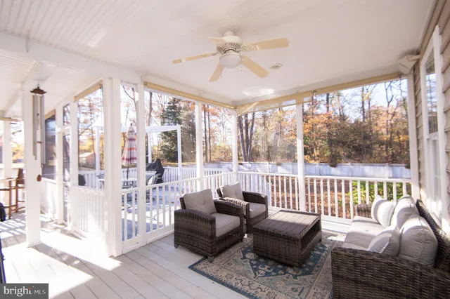 a view of a large window with wooden floor and outdoor space