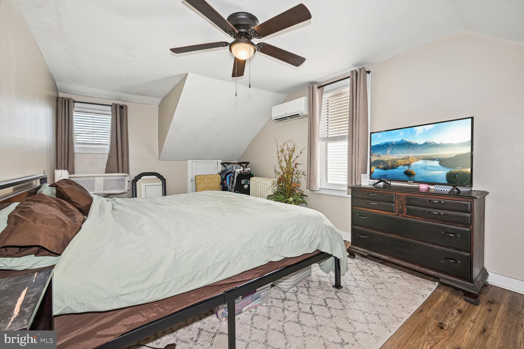 48 Haverford Road Runnemede, NJ 08078 - Photo 15 of 23 a bed room with a bed and a flat tv screen