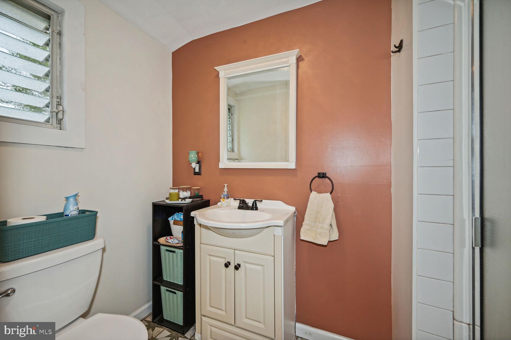 48 Haverford Road Runnemede, NJ 08078 - Photo 18 of 23 a bathroom with a sink toilet and mirror