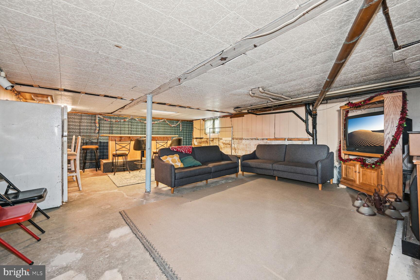 48 Haverford Road Runnemede, NJ 08078 - Photo 19 of 23 a living room with furniture a couch and chairs